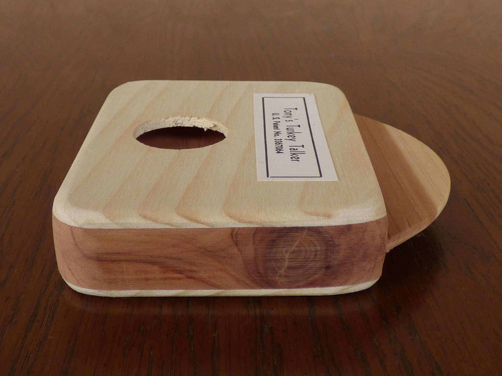 This turkey call is surrounded by Western cedar.